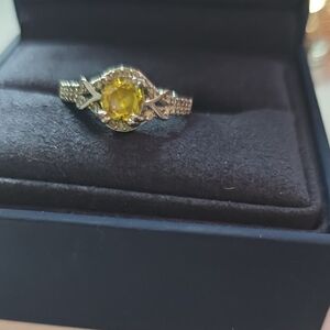 Elegant Silver and Yellow Gemstone Ring